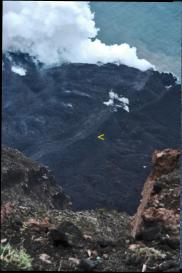 two volcanogist retrieve lava samples